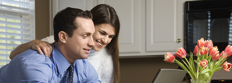 couple in a front of computer